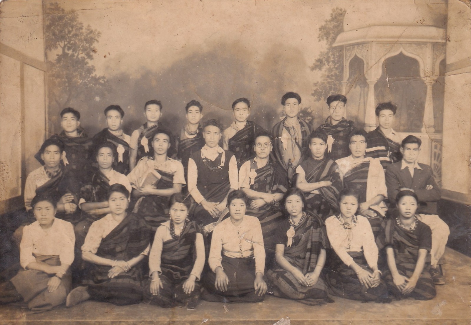 Friends gathered outdoors in a historical photograph